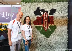 Raz Shalom and Ginna Ramos of Beauty Line with the Kenyan flag made out of flowers.