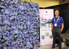 Paul Kamps next to Kamps Hydrangea’s wall of hydrangeas