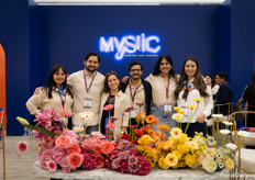 The team of Mystic Flowers in their colorful booth