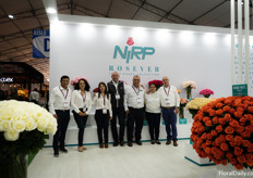 The Nirp team in their booth full of roses