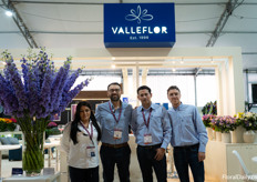 The Valleflor team in their booth showing huge Delphinium 